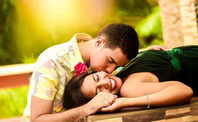 In the gentle sunlight surrounded by green plants, a confident man kisses a happy woman who has a red flower in her hair. Their connection is clear, showing how testosterone can affect people. You can see this peaceful moment in image couple-1612679_640. Subscribe For a Free eBook