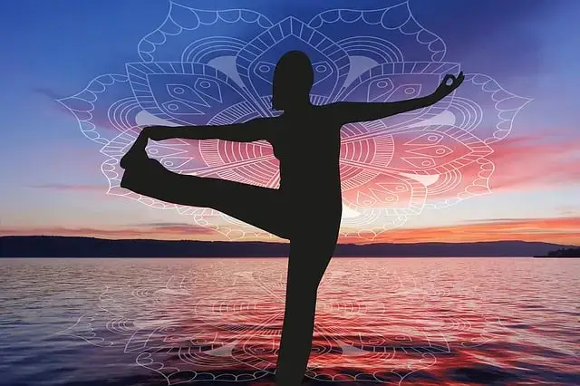 The picture called yoga-1234521_640 shows someone doing a yoga pose on one leg next to a calm lake during sunset, with a mandala pattern on top. This peaceful scene is similar to natural ways of helping the body, like testosterone replacement therapy. Subscribe For a Free eBook